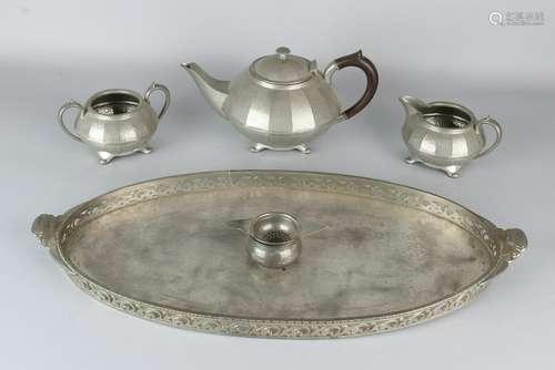 English hammered pewter tea set on tablet. Civic