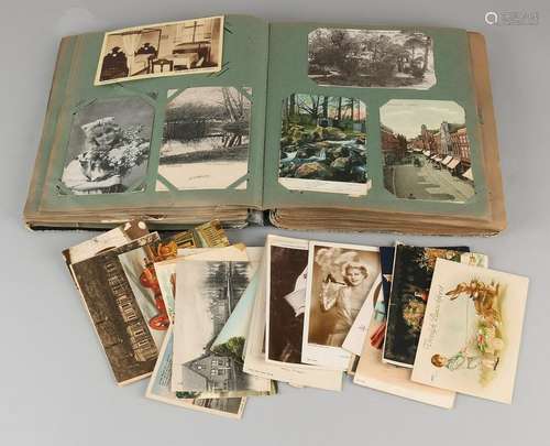 Big collection of pre-war postcards in album. First