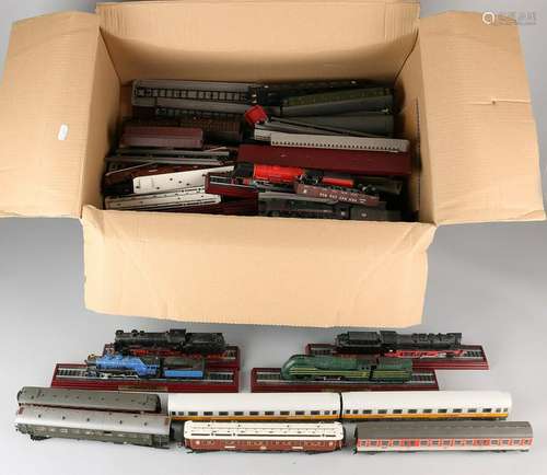 Box with different (people) cars and model trains.