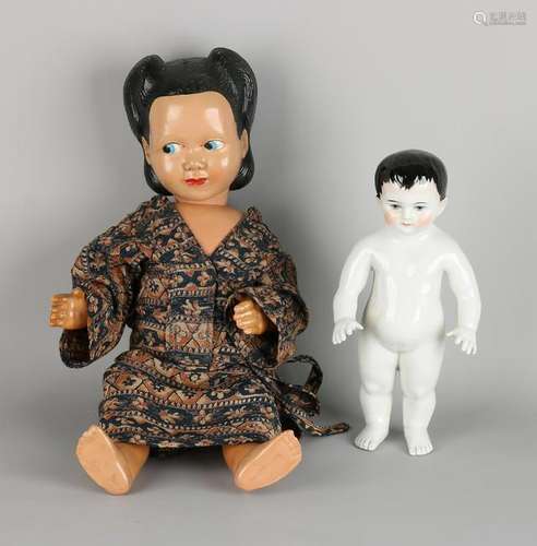 Two antique dolls. One bad times German doll. One time