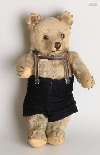 Antique teddy bear with straw and felt + glass eyes.