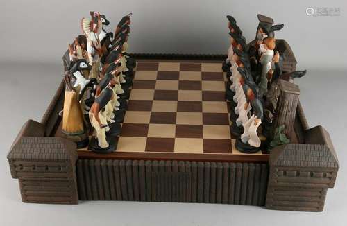 Large ceramic chess. Cowboys against Indians. With