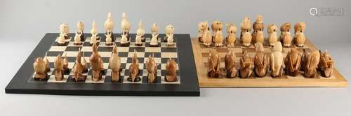 Two Taqua nuts carved chess sets with birds. Ecuador.