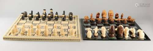 Two chess games. One time Taqua nuts carved figures /