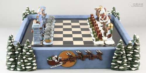 Ceramic Christmas chess with casing and containing a