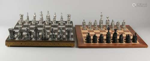 Two chess games. Comprising: One time pewter chess with