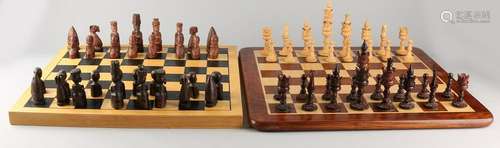 Two chess games. Comprising: One time carved lotus set,