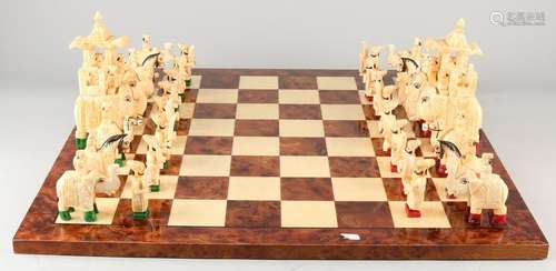 Indian game of chess with camel legs figures and burl