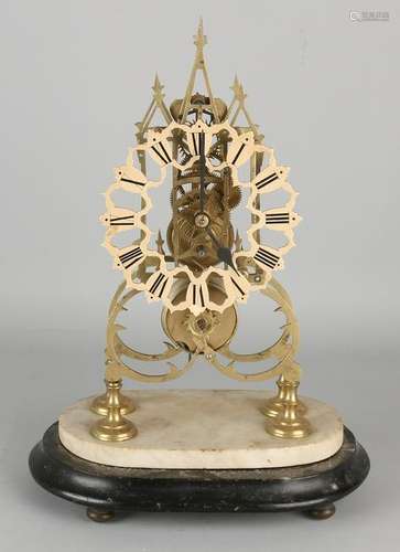 Antique English brass skeleton clock with fusee. On