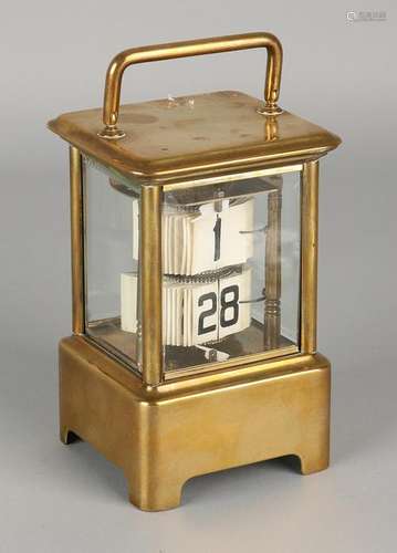 Antique calendar travel alarm clock. Circa 1920.