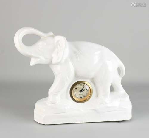 German white-glazed ceramic clock with Mercedes