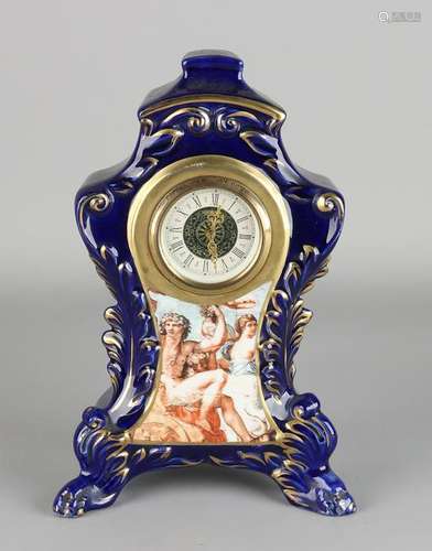 Italian porcelain clock with Roman representation.