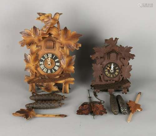 Two old German wood carved cuckoo clocks. 20th century.