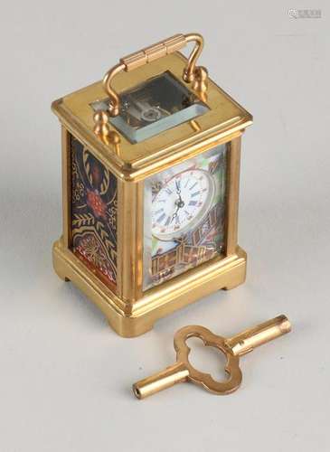 Small old mini travel alarm clock. Brass with porcelain