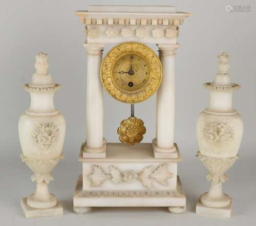 Early 19th century alabaster Empire clocks couple with