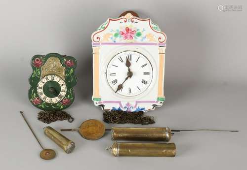 Two antique German Black Forest clocks. One times