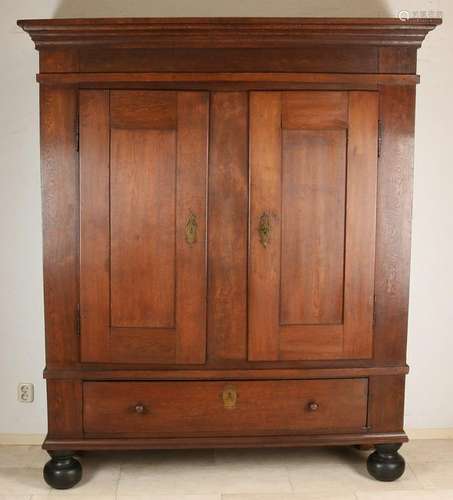 Oak Louis Seize cabinet with black border and ball feet