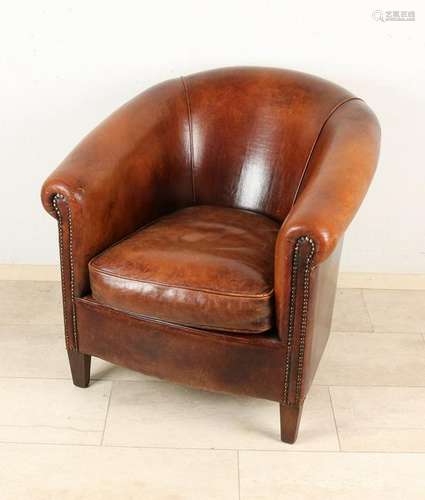 Old English leather armchair in a horseshoe pattern