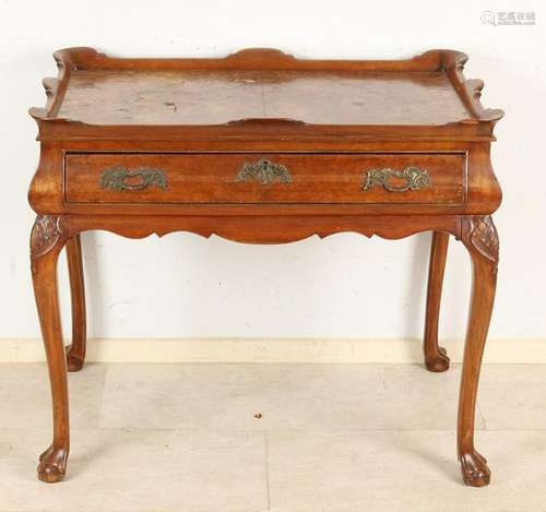 19th Century Dutch walnut tea table with claw feet.