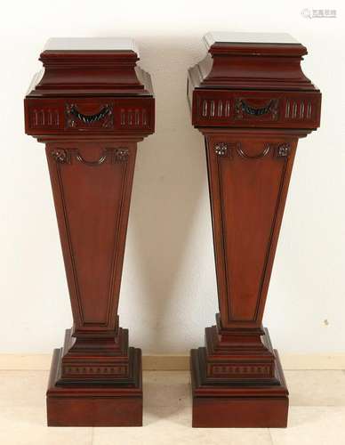 Two large mahogany pedestals in the Louis XVI style.