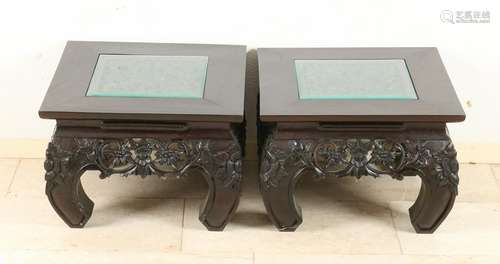 Two Oriental carved teak side tables. 20th century.