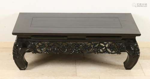 Oriental teak coffee table with floral carvings. Second