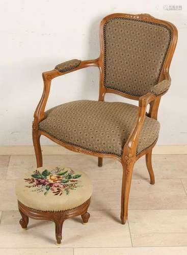 Old Louis XV-style armchair with ottoman. 20th century.