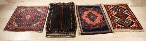 Four little different ancient Persian carpets with