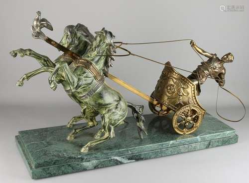 Large antique bronze chariot on marble base.