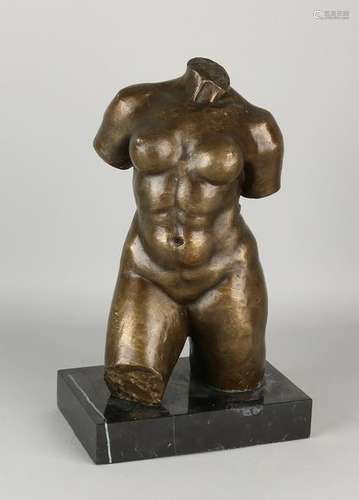 Modern bronze torso. Female nude on black marble base.