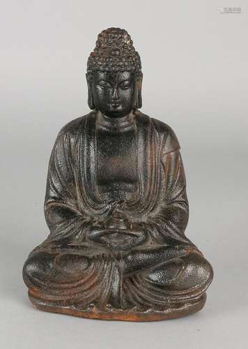 Old / antique Chinese iron Buddha in lotus position.