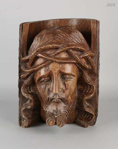 Antique from walnut tree trunk inserted Jesus head.