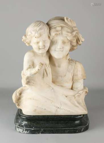 Large antique marble bust. Mother with child. On black