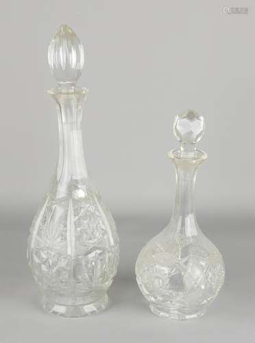 Two faceted crystal decanters. 20th century. Size: H