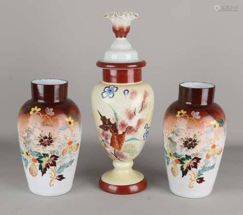 Three antique opaline vases with floral decor. Circa