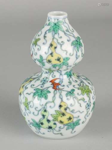 Ancient Chinese porcelain vase with lump gourd decor.