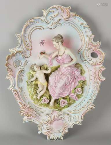 Large porcelain wall plaque in Rococo style. With