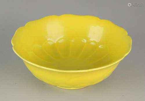 Ancient Chinese porcelain bowl with yellow enamel.