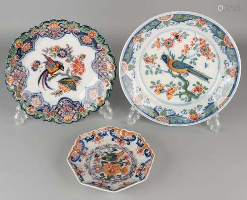 Three old Makkum polychrome painted ornamental plates.