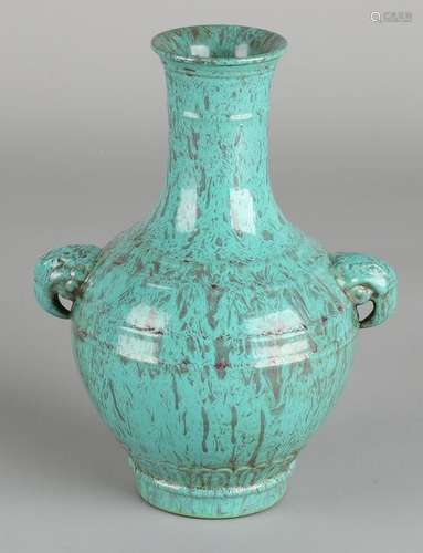 Ancient Chinese porcelain vase with green glaze, bird