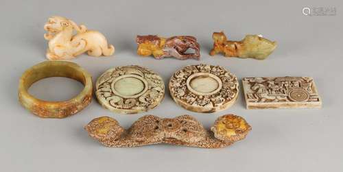 Eight times various ancient Chinese jade objects. 20th