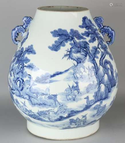 Large antique Chinese blue / white vase surrounded by