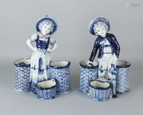 Two antique Delft porcelain figures. Boy and girl with