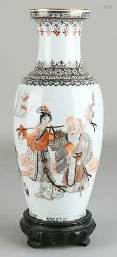 Ancient Chinese porcelain vase on pedestal. Figures