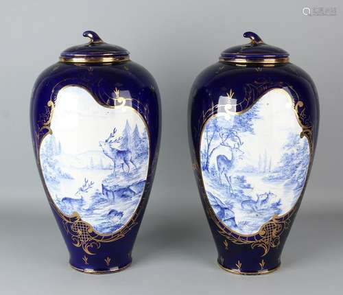 Two large cobalt blue porcelain lidded vases. Hand