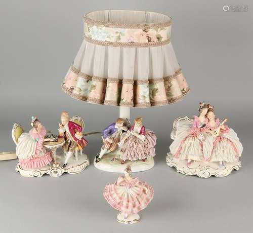 Four German porcelain figures. Consisting of: Lamp,