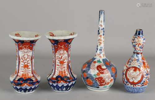 Four 19th century Imari porcelain vases. Consisting of: