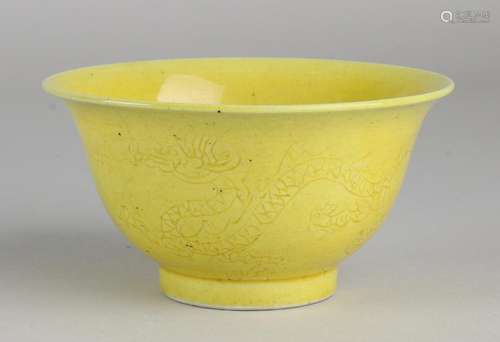 Ancient Chinese porcelain bowl with yellow frosting and