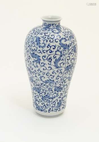 A Chinese blue and white 'Plum' vase decorated with scrolling foliage. Character marks under.