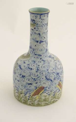 A Chinese famille rose mallet shaped vase with enamel decoration depicting dragons emerging out of